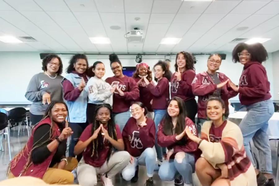 Lambda Theta Alpha 2022 members in a classroom.