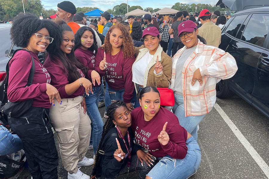 Lambda Theta Alpha 2022 members at a tailgate party.