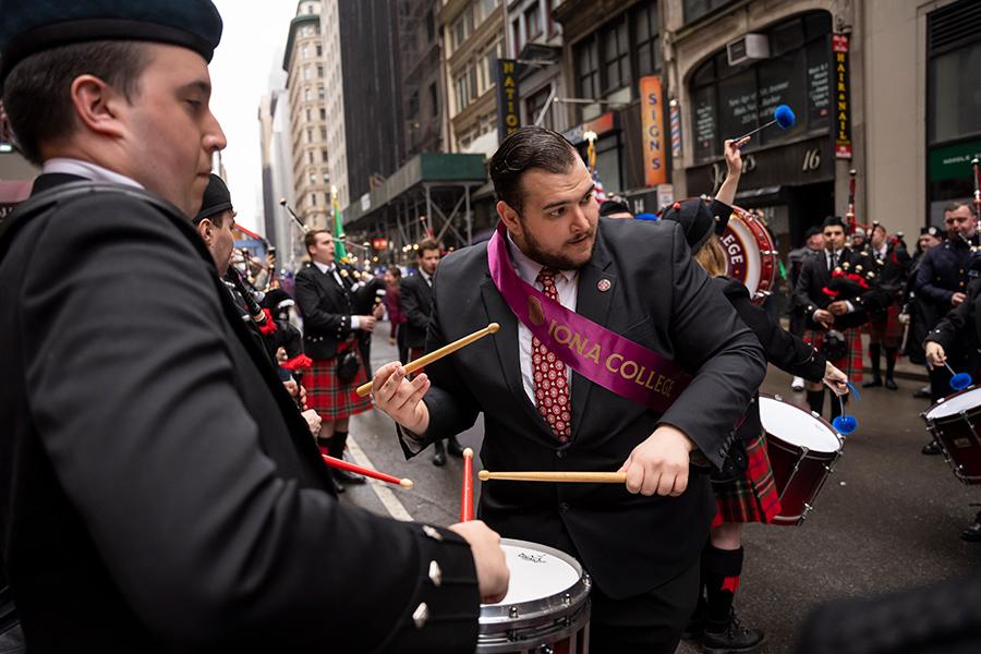 Liam plays a drum in the St. Patricks Day parade.