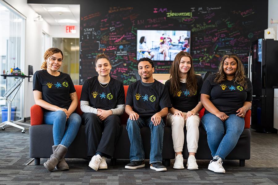 Students sit on a couch at the Hynes Institute.