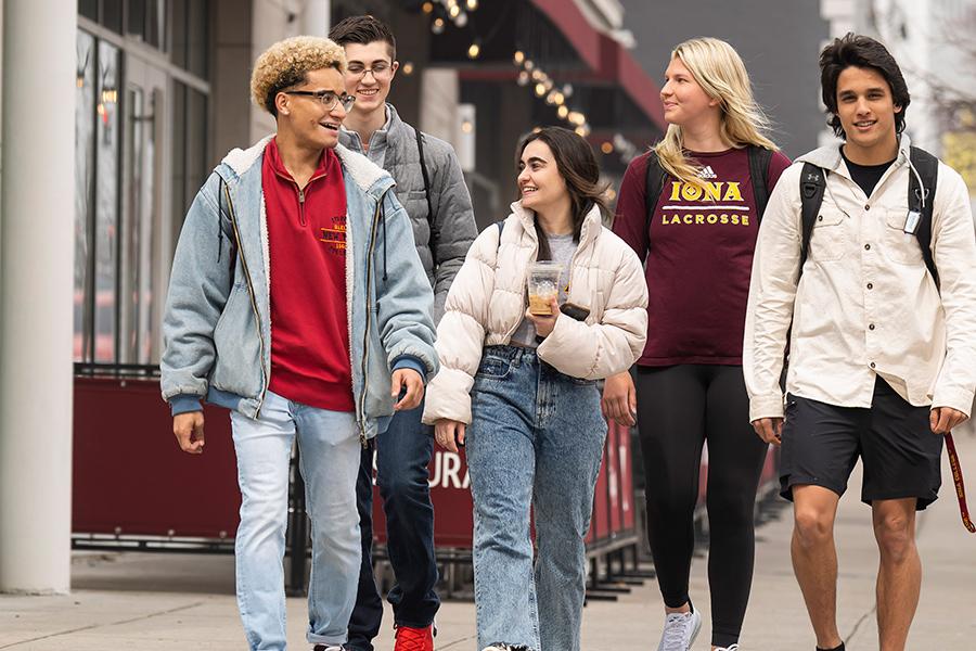 Iona students walk down North avenue by the Mirage.