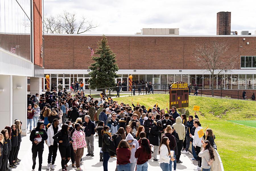 An open house group outside of LaPenta School of Business.