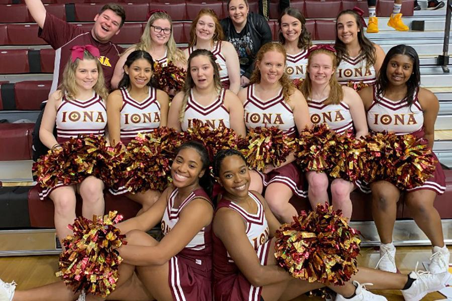 The Iona cheerleading team poses by the bleachers in the arena.