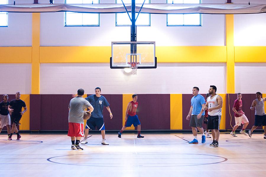 Students play a pick-up game of basketball in the Mulcahy Gym.