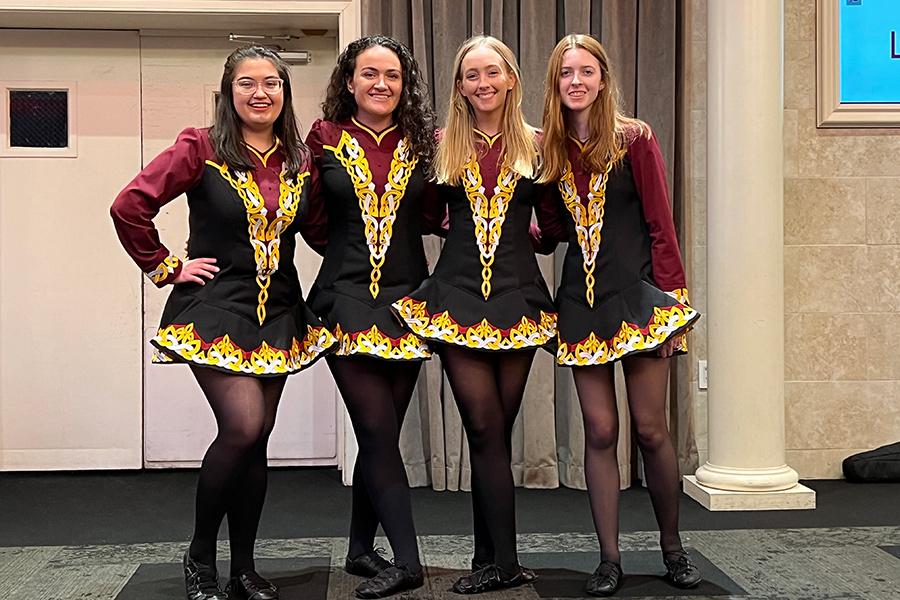 Four members of Iona Irish Dance at a competition.