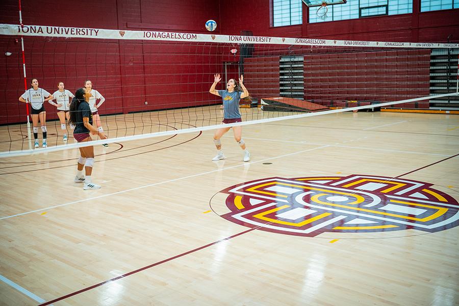 The volleyball team practicing in the gym in Bronxville NY.