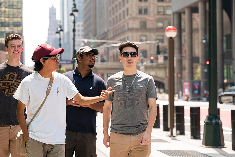 Students from Iona University walk down 42 street in NYC.