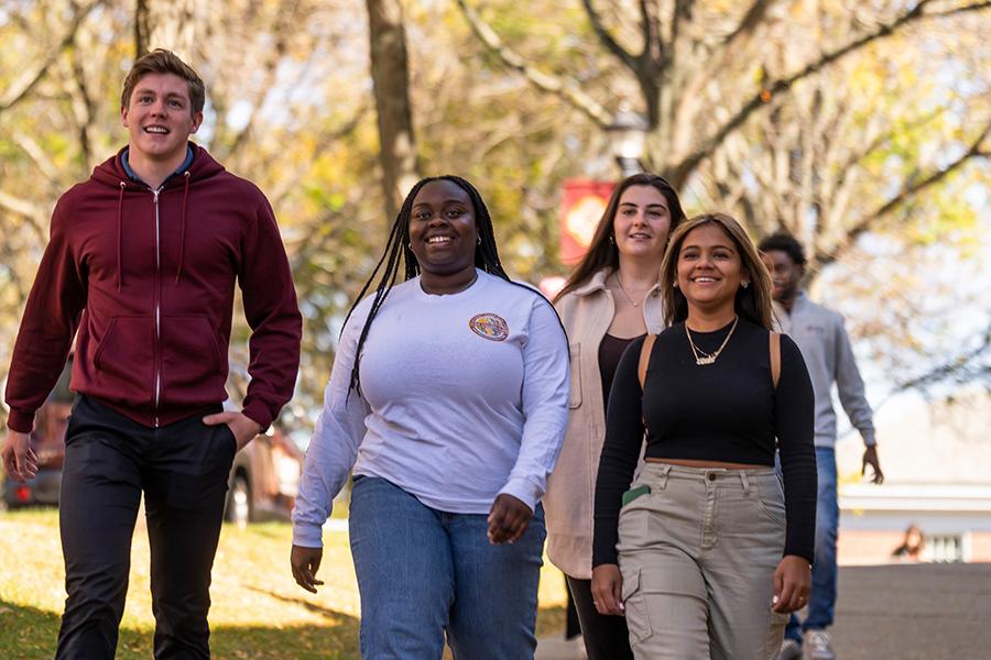 Two students walk toward the North Ave. entrance on the Iona campus.