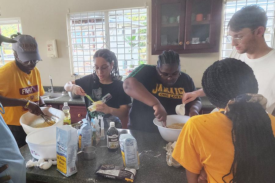 Students baking with residents during the Jamaica trip.