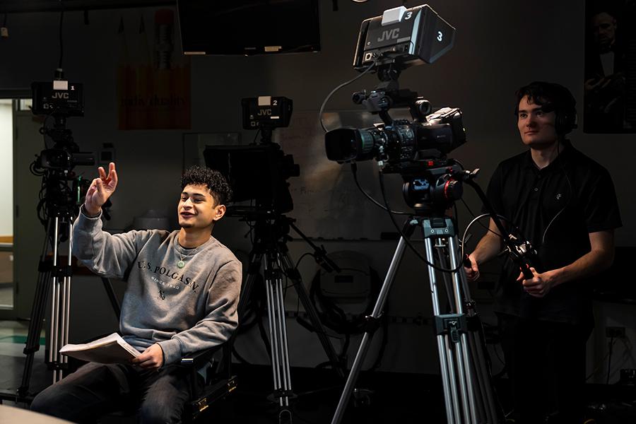 A camera person and a director work on a show at Iona University.