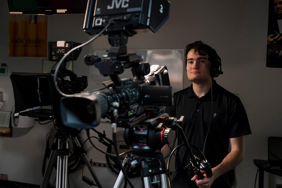A student works the TV camera at Iona University.