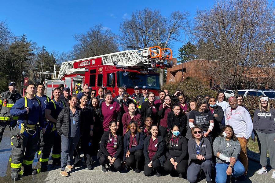 The nursing students, professors and Eastchester fire department from the nursing simulation.