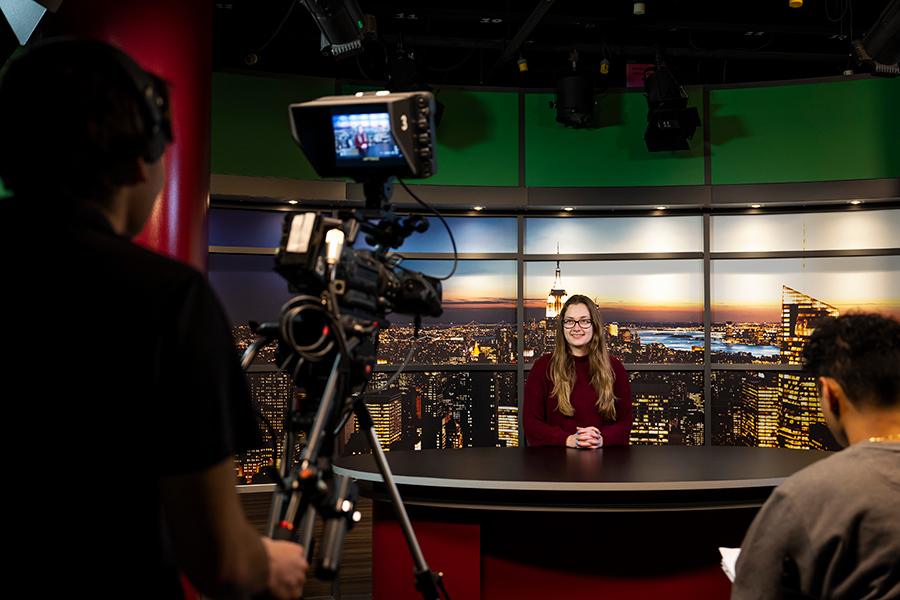 Three students work on a TV show at Iona University.