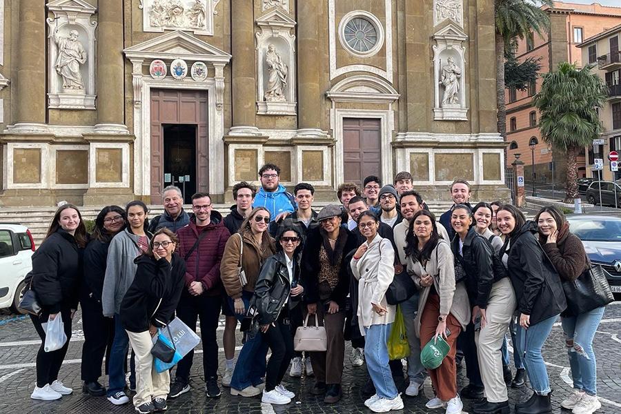 Iona group in a city square in Italy.