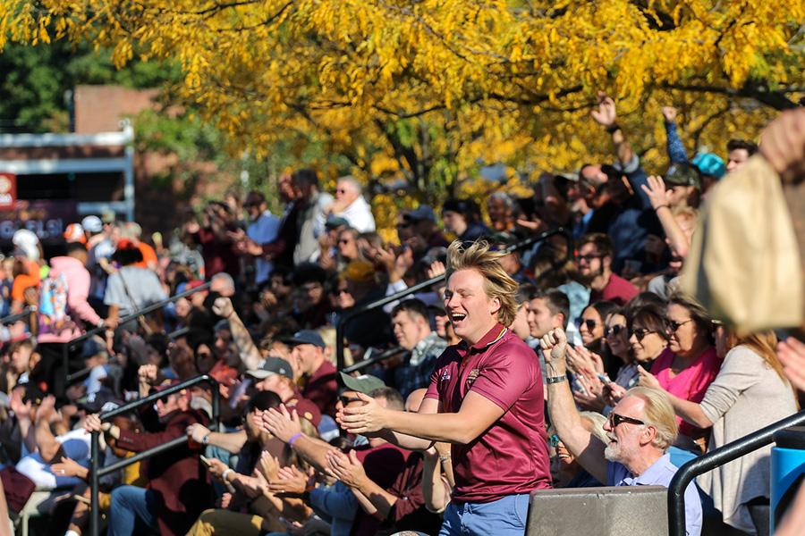 Students cheer at the 2023 homecoming game.