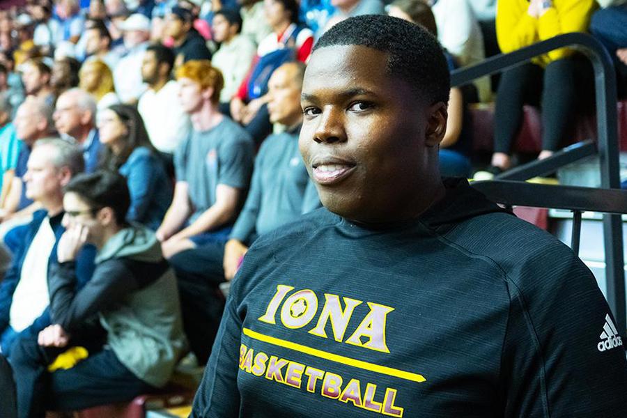 An Iona student worker for Athletics at a basketball game.