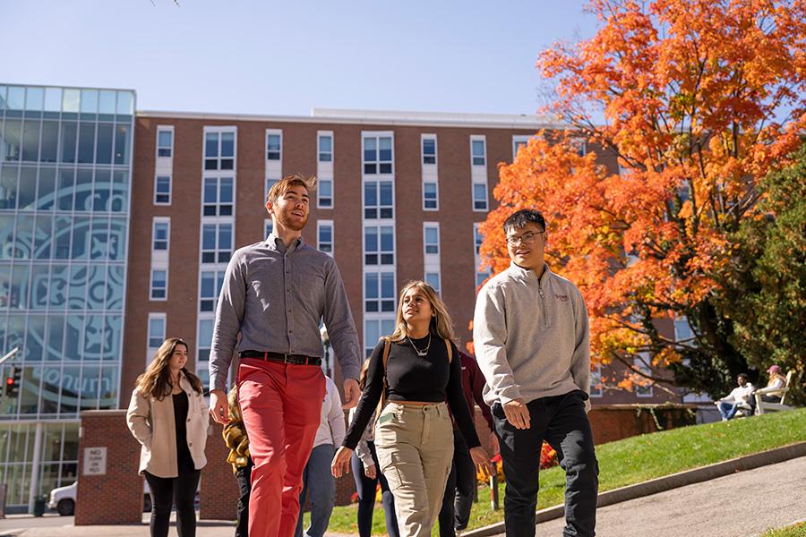 Students enter campus from North Avenue on a sunny fall day.