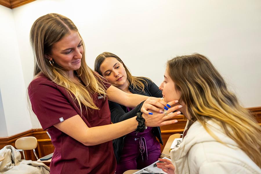 Three CSD students practice techniques.