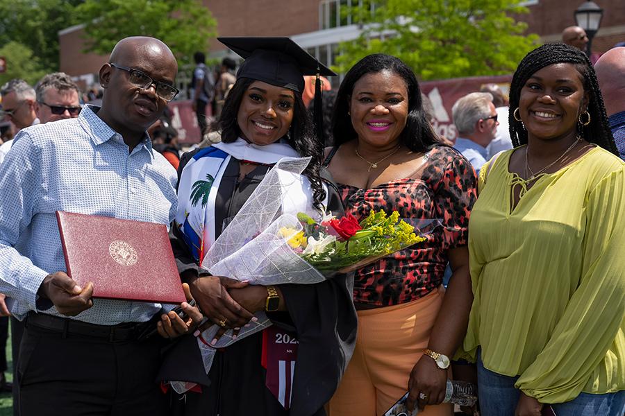 An Iona family with their daughter at graduation.