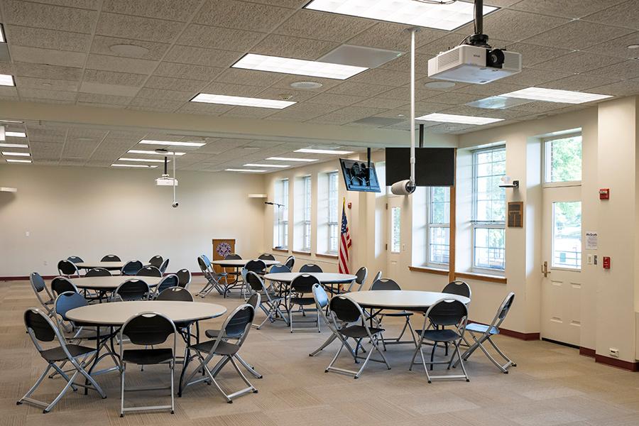 McGrath Room A set up with tables and chairs.