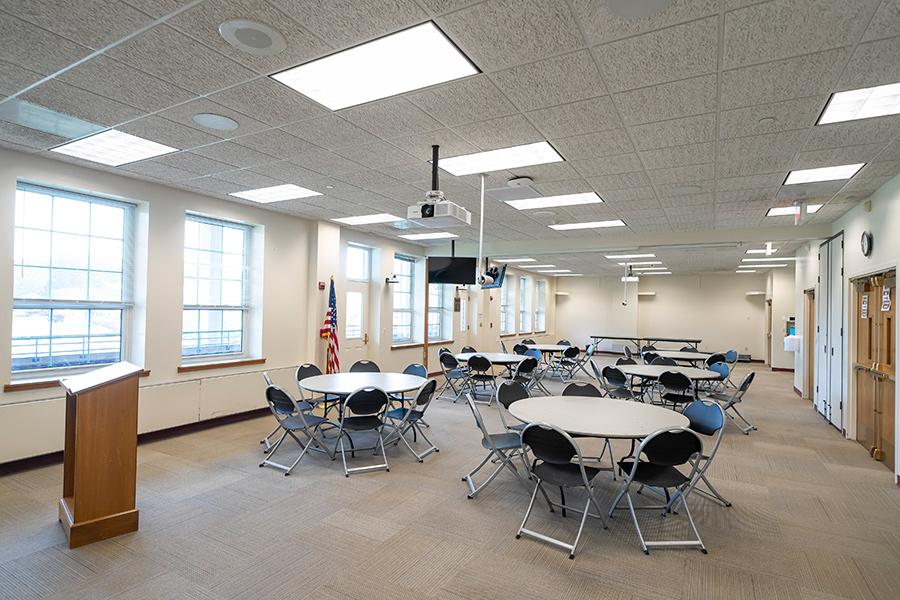 McGrath Room B set up with tables and chairs.