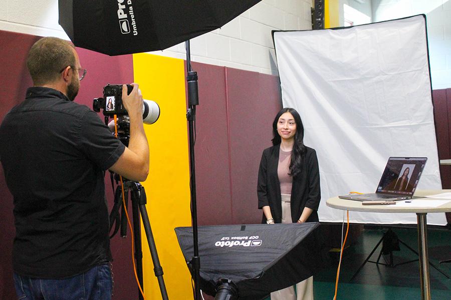 A student gets her headshot taken at the career fair.