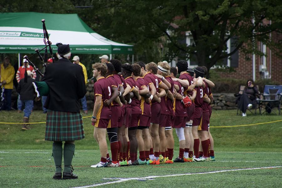 The Rugby team huddling up before a game.