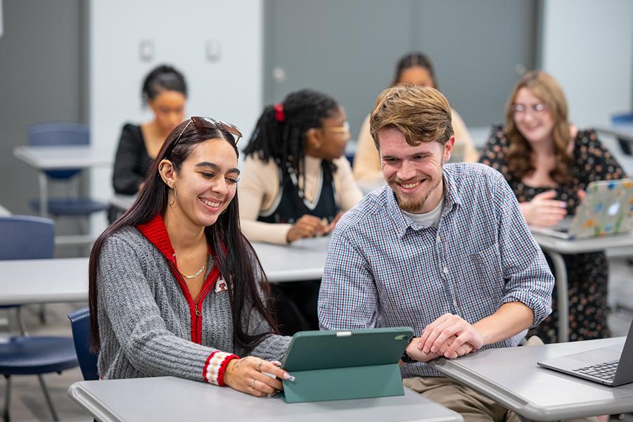 MBA students studying together in class.