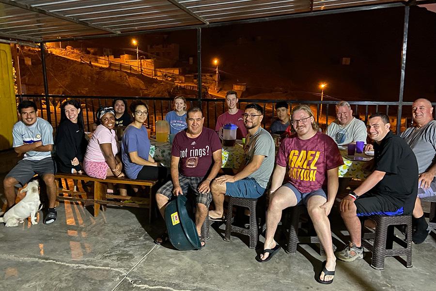 Participants enjoy an evening meal in the mountains of Peru.