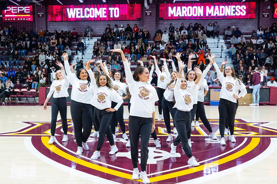 The dance team welcomes students to Maroon Madness.