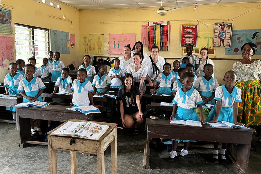 Nursing students visit a Catholic 3rd grade classroom in Ghana.