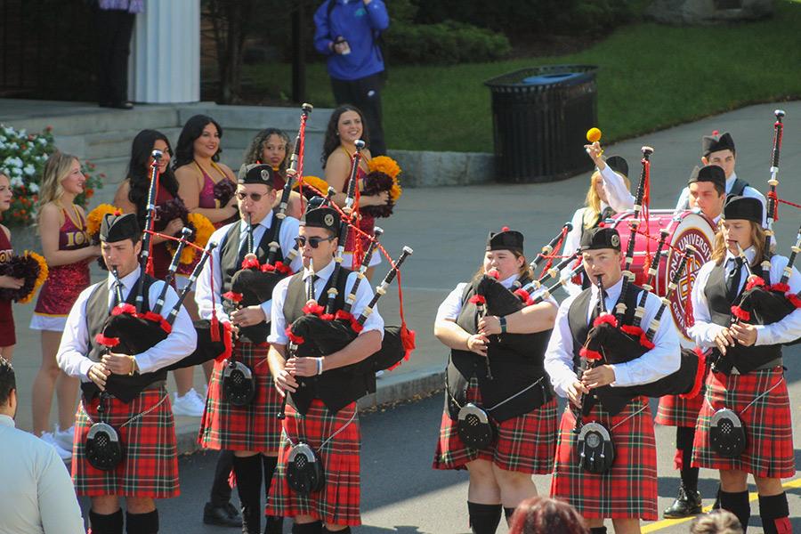 The piper band plays outside of Spellman Hall.