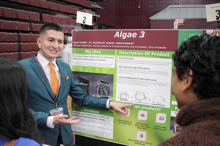 A student presenting on his product idea called Algae 3.