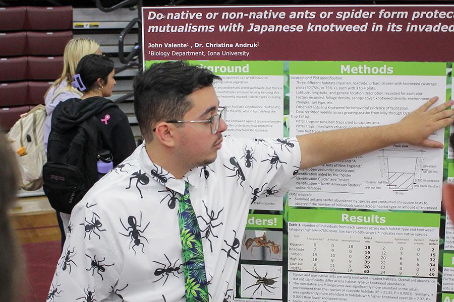 A student presenting a study on ants and spiders in Japan.