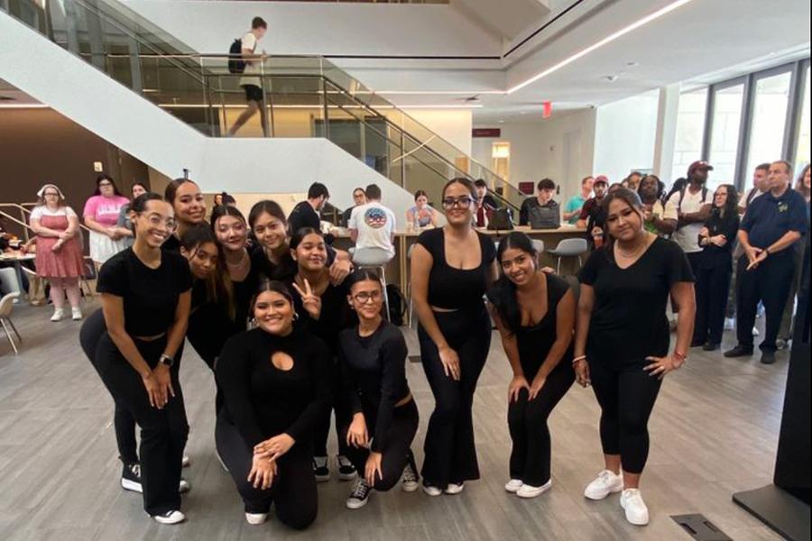 Bailando con Sazón in the atrium of the LaPenta School of Business.