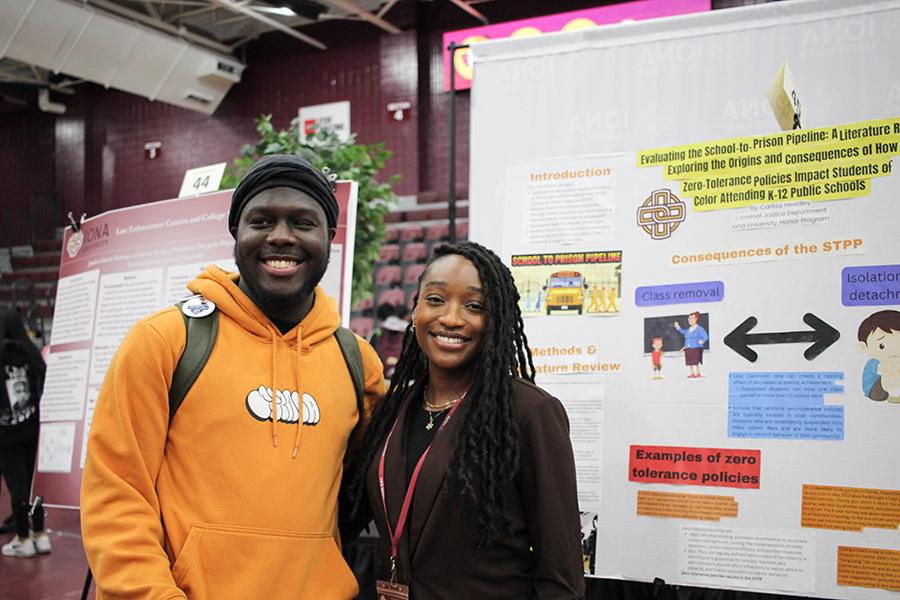 Two students presenting on the 'Pipeline to Prison' issue.