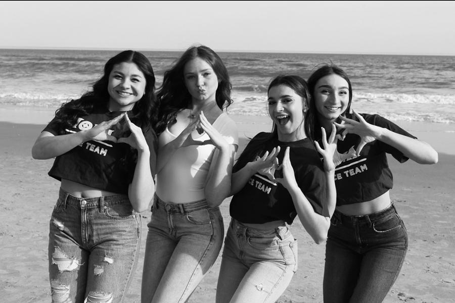 Four members of Phi Sig at the beach.