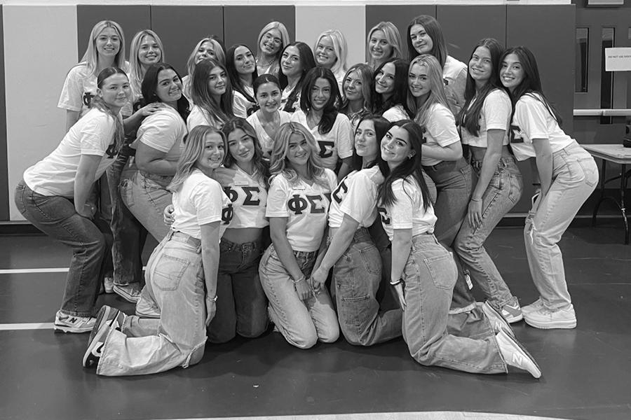A group shot of members of Phi Sig in Mulcahy Gym.