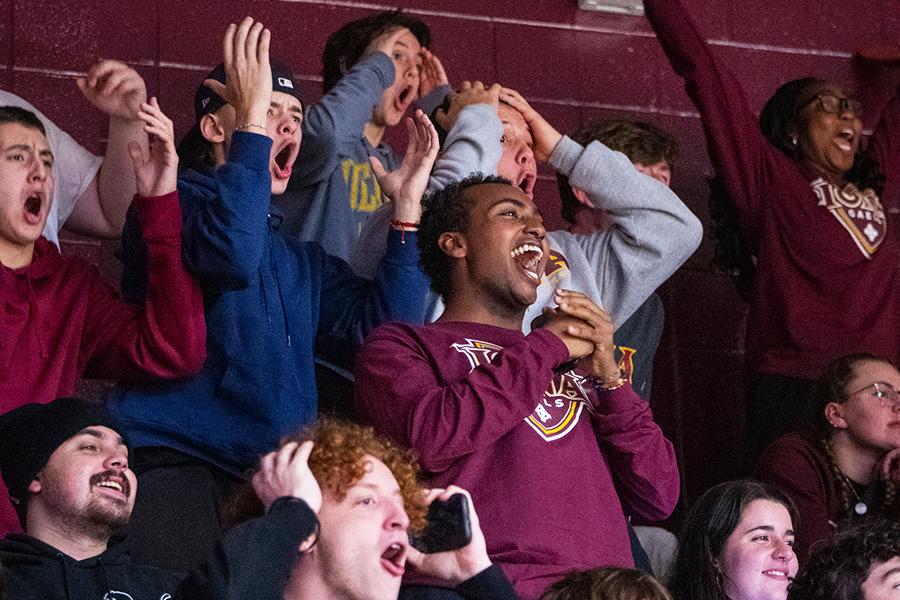 Students cheer at an Iona basketball game.