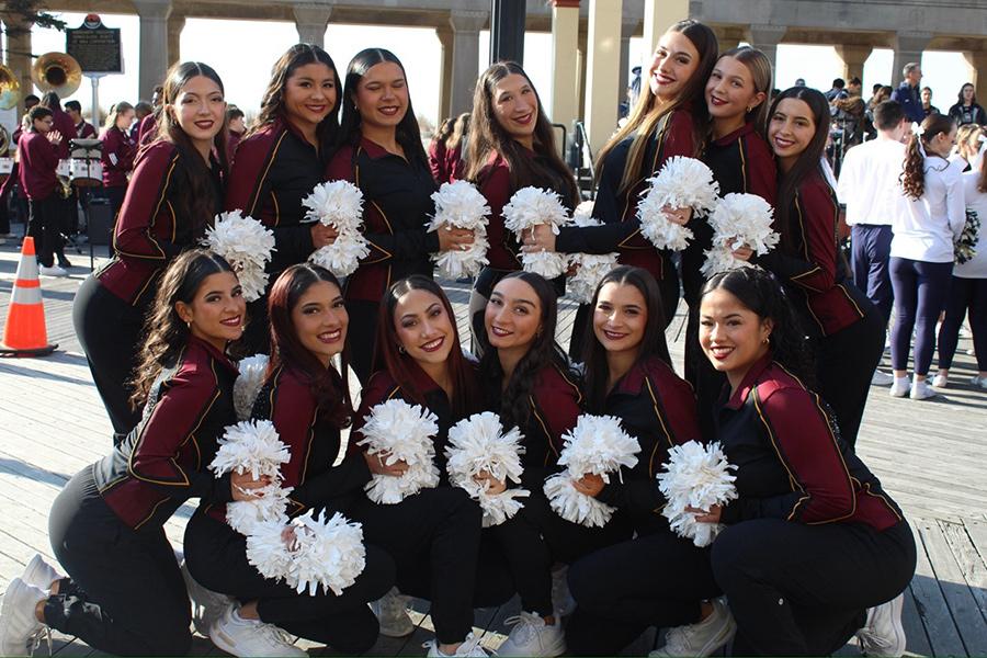 Iona Dance Team smiling and posing for a group photo outside.