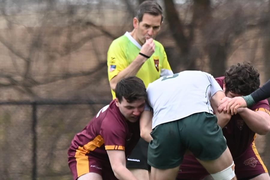 Tommy Byrnes ’26 playing in a rugby game on a field.