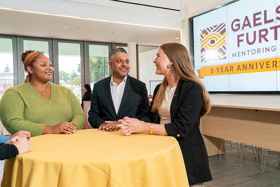 Victoria Curreri networking at the Gaels Go Further Five Year Anniversary Event at the LaPenta School of Business Atrium.