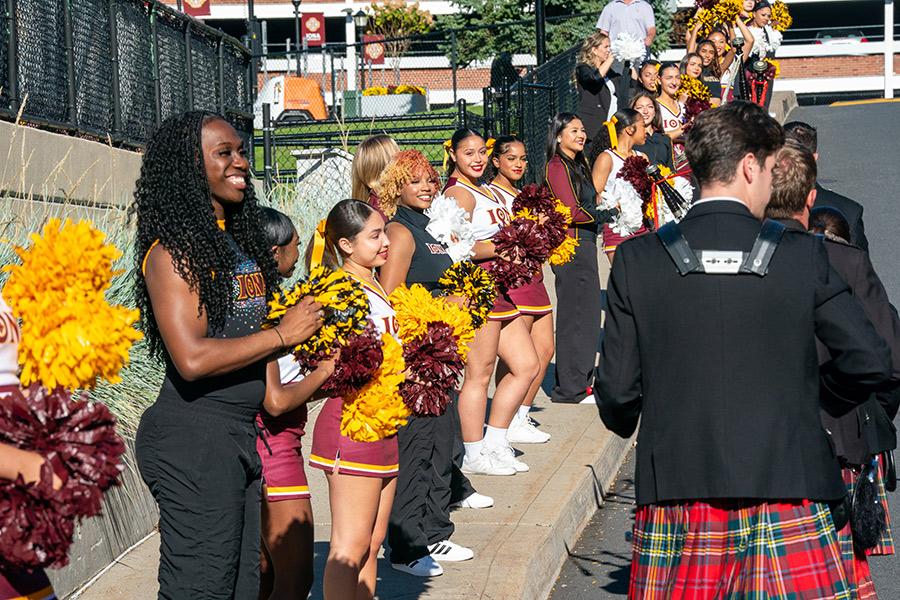 Homecoming 2025, Iona cheerleading team and Iona pipe band attending the event.