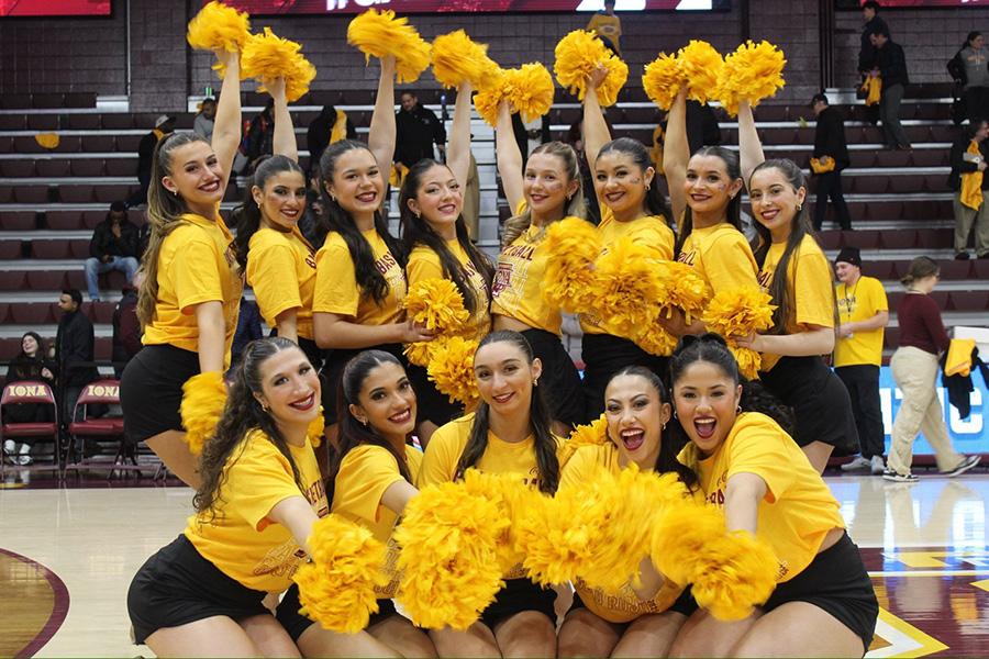 The Iona Dance Team posing for a group photo at an event in the Mulcahy Gymnasium. 
