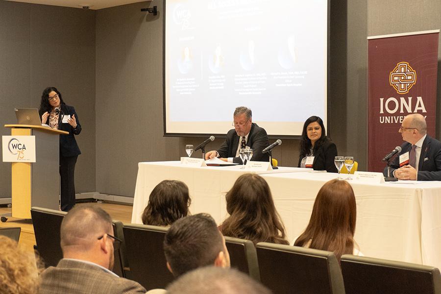 Kavita moderating the panel.