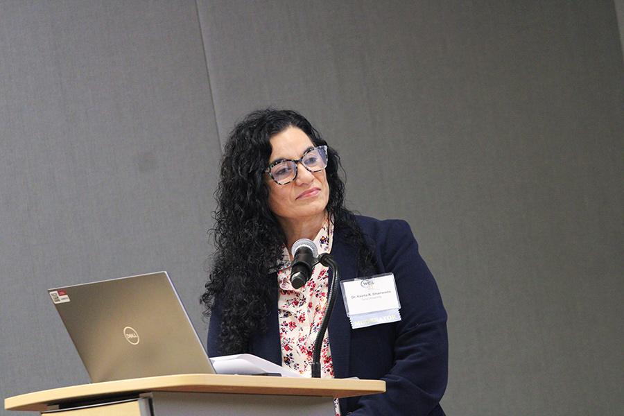 Kavita speaking the podium.