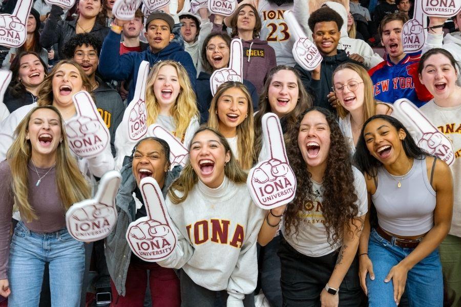 Students cheering at basketball game