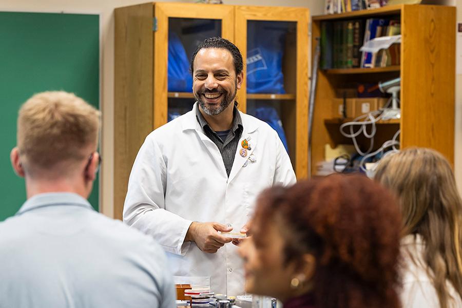 Dr. Zuckerman teaches in a biology classroom.