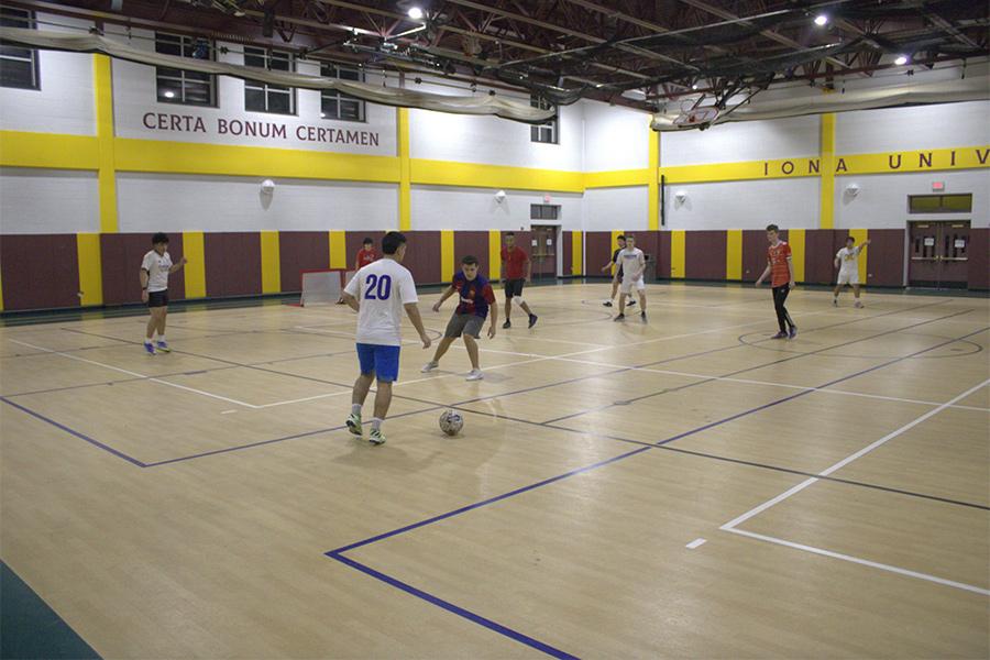 Students play a pick-up game of soccer in the Mulcahy Gym.