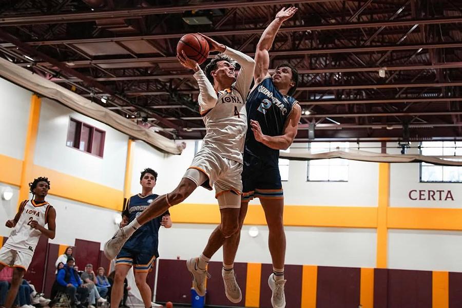 Iona club basketball team player going up for a shot in a basketball game in the Mulcahy Gym.